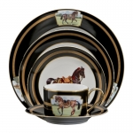 Imperial Horse Five Piece Place Setting Inspired by 18th century Continental paintings depicting the Noble Horse of Royalty, Julie Wear presents high spirited horses caparisoned in regal trappings, with ornamental saddles and bridles and adorned with tassels; she translates them into a highly sophisticated design that makes a bold statement on any table. Dramatic black ground accented with gold, including hand painted burnished gold cup handles enhances the splendor of the magnificent Imperial Horse.

Please call store for delivery timing.