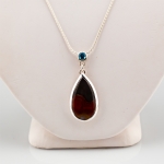 Kentucky Agate Pendant 2\ Drop
Kentucky Agate, Blue Topaz Stone, Sterling Silver
18\ Sterling Silver Chain

As each piece is handmade, personalize this item. Contact us for pricing and availability.