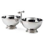 Graham Double Cocktail Bowl Decorated with a tidy trimming of simple thread, each piece in the Graham barware collection is handmade in hammered stainless steel and polished to brilliance. This two section server features double cocktail-sized bowls and a sturdy handle for transporting your favorite nibbles. 