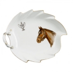 Bluegrass Leaf Dish A setting so special, Meissen calls it Bluegrass. The world\'s finest porcelain and Kentucky world-famous equine traditions come together in the Bluegrass series from Meissen. Hand-painted on the Waves form on smooth surface, this handsome new equine pattern was designed in 2000-2001 in collaboration with L.V. Harkness & Company and presented exclusively to L.V. Harkness in 2001 by Meissen. Twelve place settings reside proudly in the Kentucky Governor\'s mansion. Please contact store for delivery timing. 

MEISSEN occupies a unique position amongst porcelain makers worldwide. As the oldest porcelain manufactory in Europe, founded in 1710 by King Augustus the Strong, the dining services, sculptures and objects created by Meissen have been trailblazing since the very beginning. The manufactory\'s worldwide renown is rooted in artisanal expertise and centuries of artistic tradition, beginning from Meissen’s Baroque period, which laid the foundation for a design language for European porcelain, iconic floral painting and the “Onion Pattern”, all the way to the new animal sculptures of the 1920s. In every era, the Meissen manufactory gave rise to some the most significant porcelain artists of the time, whose masterpieces both then and now are produced entirely by hand. Their works reflect not only the great variety of artistic epochs, but also the boundless creativity and curiosity that continues to stoke the creations in Meissen Triebischtal to this day.