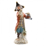 Triangle Player Figurine Created in 1753 by the highly gifted Johann Joachim Kaendler (1706-1775), the \Triangle Player\ is one of the 21 imaginative creations playing in the Monkey Orchestra.