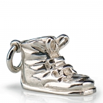 Baby Shoe Charm .75\ x .375\ x .5\

Sterling Silver Care: Wash your sterling silver in warm water, using mild soap and a soft cloth. Dry with a soft cloth. Your sterling silver should never be exposed to an open flame or excessive heat.
Store your sterling silver trays flat, cups upright, etc. to prevent warping. Do not wrap sterling silver in anything other than the original wrapping to prevent scratching. With proper care, your sterling silver will last for generations. Never put sterling silver in a dishwasher. Hand wash only.

As each piece is handmade, personalize this item. All sterling silver prices are subject to change, contact us for pricing and availability.
