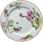 Summerlea Dinner Plate Julie Wear gathers ordinary fruits and vegetables from the garden and combines them together in unexpected ways to create a pattern of delightful color and movement. 